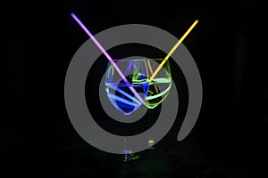 Colorful alcoholic transparent beverages with dark background for party celebration, new year, bar and christmas with straw