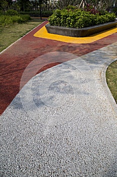 Colorful alley with carpet and plant bed in the park