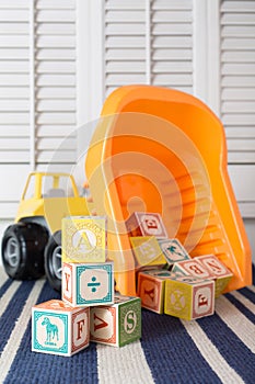 Colorful Alphabet blocks and toy dump truck