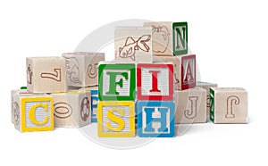 Colorful alphabet blocks. Word fish isolated on white background