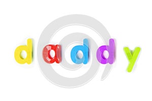 Colorful alphabet magnets spell `daddy` over white background