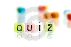 colorful alphabet word cube of QUIZ on white