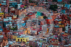 Colorful ancient American cathedral architecture in crowd, Guanajuato, Mexico