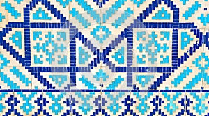 Colorful ancient traditional Uzbek pattern on the ceramic tile on the wall of the mosque