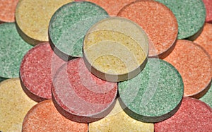 Colorful antacid pills up close.