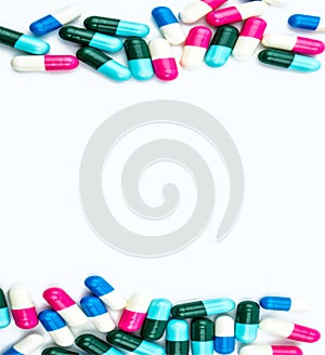 Colorful of antibiotic capsules pills isolated on white background with copy space.