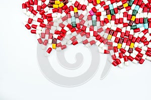 Colorful of antibiotic capsules pills on white