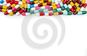 Colorful of antibiotic capsules pills on white background