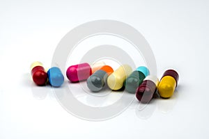 Colorful of antibiotic capsules pills on white background with copy space