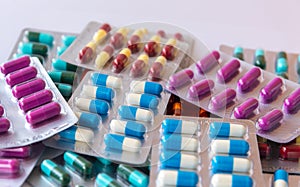 Colorful antibiotic drug capsule pills in blister package