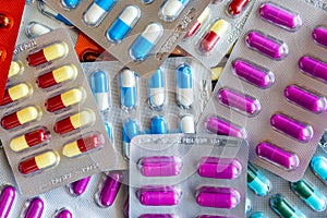 Colorful antibiotic drug capsule pills in blister package