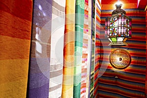 Colorful arabic carpets and lamp in Marrakech, Morroco