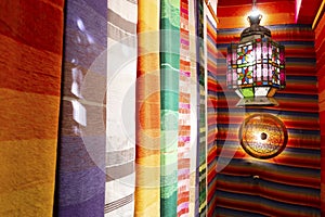 Colorful arabic carpets and lamp in Marrakech, Morroco photo
