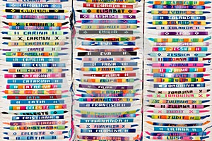 Colorful arm bracelets with embroidered names