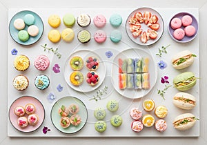 Colorful array of assorted desserts arranged neatly on a white surface