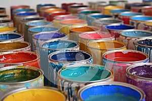 Colorful array of open paint cans