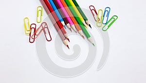 Colorful art and drawing concepts, Crayon pencils and clips on white background