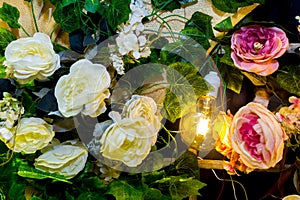 Colorful artificial flowers with Decorative antique Edison style filament light bulbs