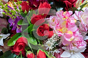 Colorful artificial handmade flowers background.