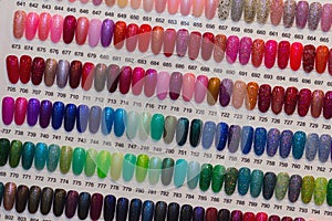 Colorful artificial nails on shelves