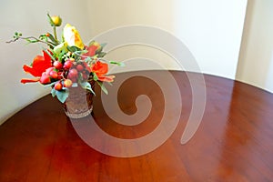 Colorful Artificial Yellow Orange Rose Vase on Wooden Table