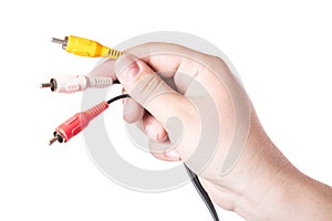 Colorful audio video cable connectors in hand isolated on white background.