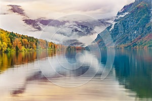 Colorful autumn dawn on the Bohinj lake