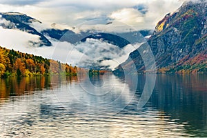 Colorful autumn dawn on the Bohinj lake in Triglav national park Slovenia, Alps, Europe.