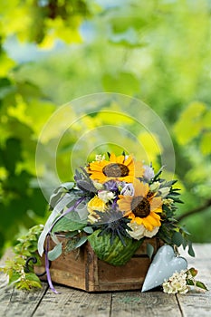 Colorful autumn flower bouquet with sun flowers