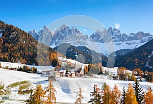 Colorful autumn landscape of Dolomite Alps..The small village of St. Magdalena