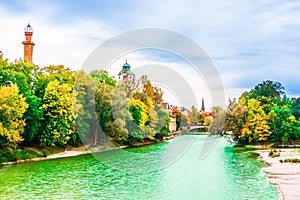 Colorful autumn landscape in front of Mueller Volksbad of Isar r photo