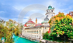 Colorful autumn landscape in front of Mueller Volksbad of Isar r photo