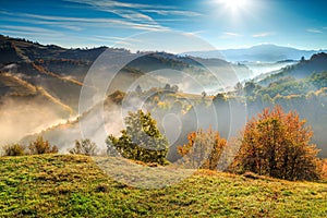 Colorful autumn landscape with misty valley,Holbav,Transylvania,Romania,Europe