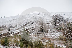 Colorful autumn in the mountains. First snow in october