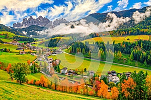 Colorful autumn scenery in Santa Maddalena village at sunny day. Dolomite Alps, South Tyrol, Italy