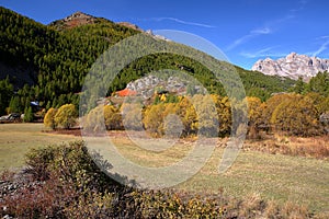 Colorful Autumn scenery in Vallee de la Claree Claree Valley above Nevache village, Hautes Alpes