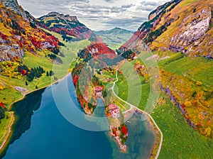 Colorful autumn view from flying drone of Seealpsee lake