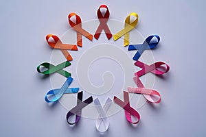 Colorful awareness ribbons arranged in a circle symbolizing hope and support