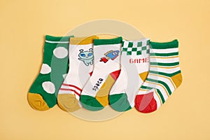 Colorful baby kid socks , different print color for boy and girl. Cloth textile.