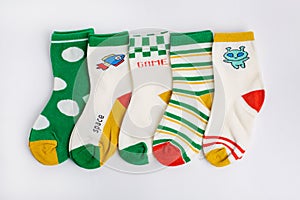 Colorful baby kid socks , different print color for boy and girl. Cloth textile.