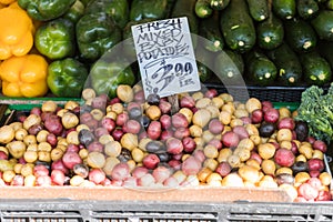 Colorful baby potatoes and other vegetables at a stall at Pike Place Market in Seattle.