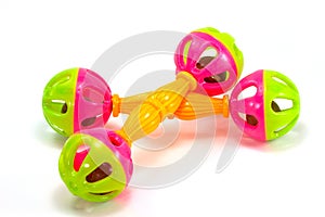 A colorful baby rattle on a white horizontal background