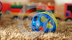 Colorful baby wood toys on light brown color carpet