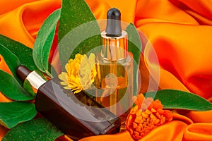 colorful background with calendula  and oil