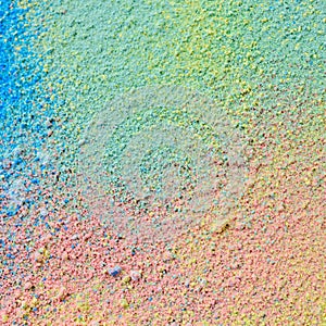 Colorful background of chalk powder. Multicolored dust particles splattered on black background