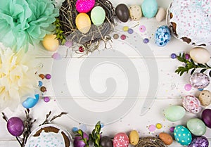 Colorful background with Easter eggs on white wooden board background. Happy Easter concept. Can be used as poster, background,