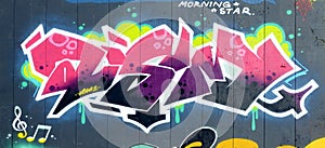 Colorful background of graffiti painting artwork with bright aerosol outlines on wall. Old school street art piece made