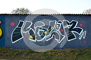 Colorful background of graffiti painting artwork with bright aerosol outlines on wall. Old school street art piece made