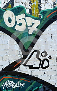 Colorful background of graffiti painting artwork with bright aerosol outlines on wall. Old school street art piece made