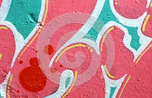 Colorful background of graffiti painting artwork with bright aerosol outlines on wall. Old school street art piece made